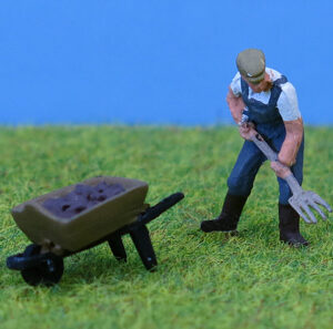 Farmer with Pitchfork and Barrow