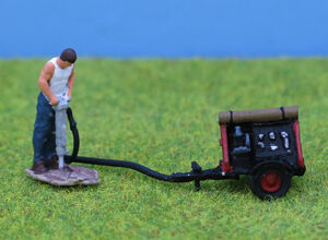 Man with Pneumatic Drill and Compressor