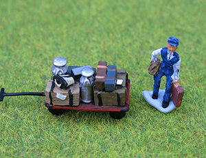 Porter with Loaded Luggage Trolly